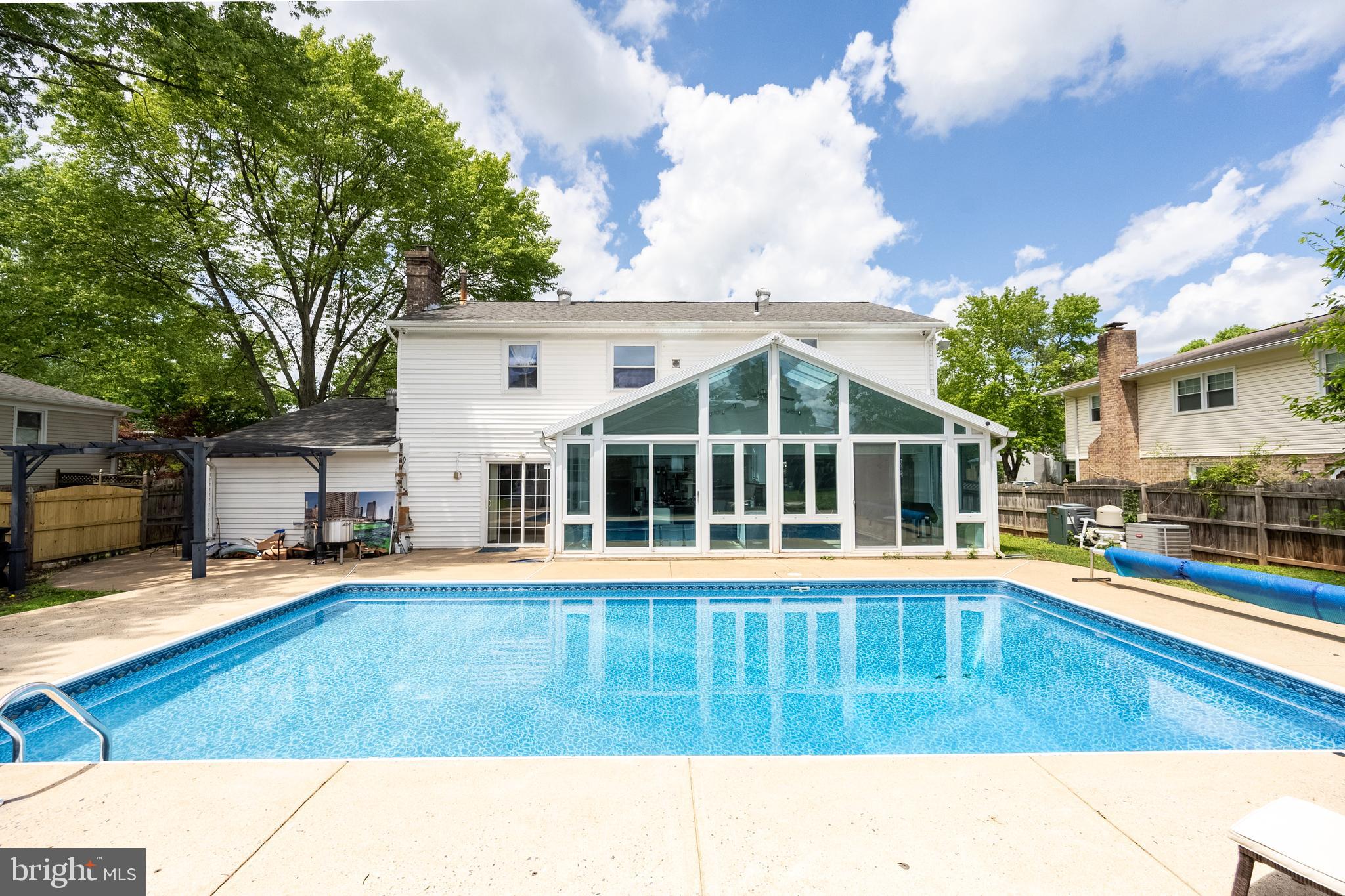 9722 Copeland Drive Manassas, VA 20109 - Photo 6 of 46 a view of a house with swimming pool and sitting area