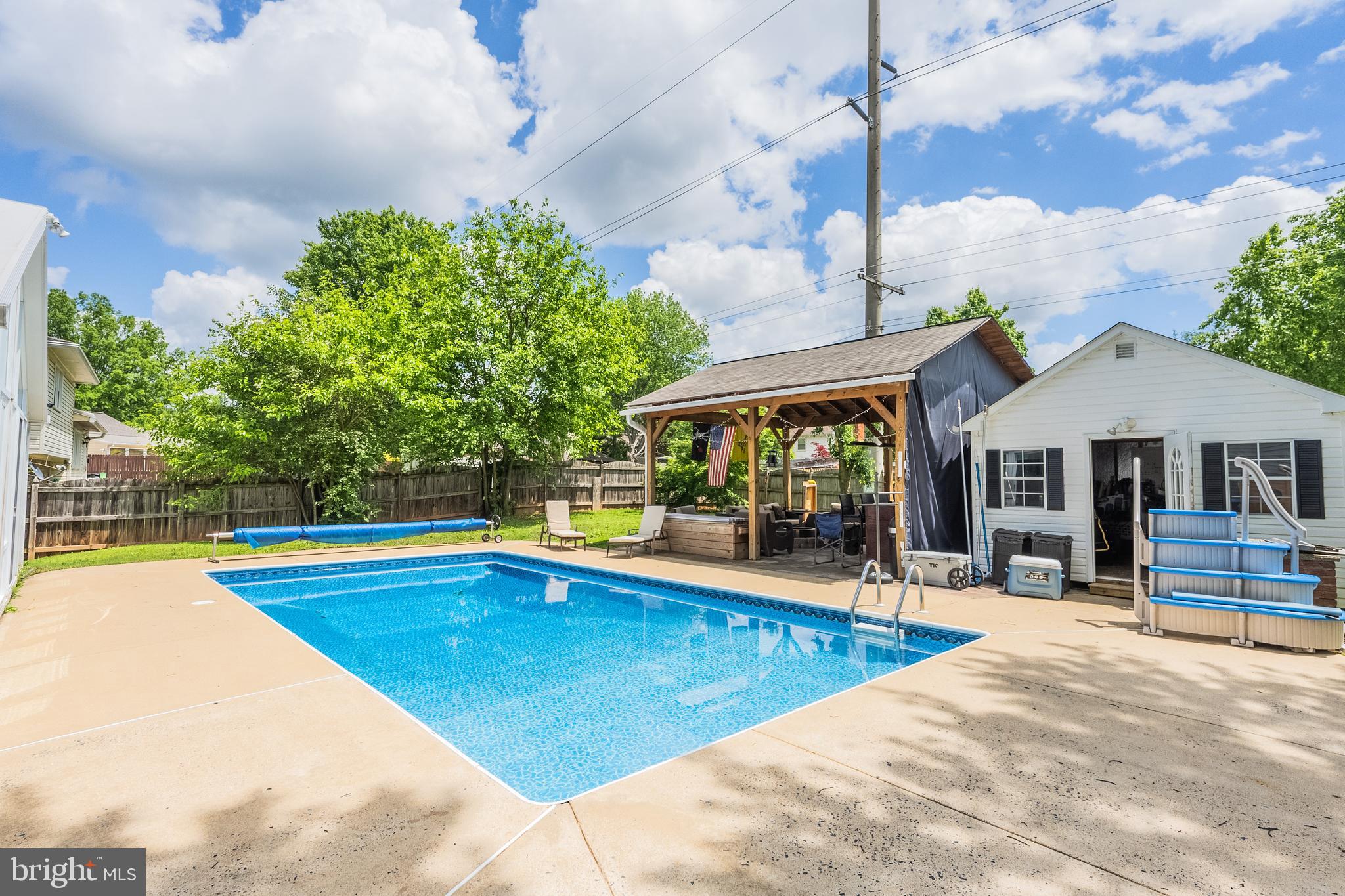 9722 Copeland Drive Manassas, VA 20109 - Photo 8 of 46 a view of a swimming pool with a patio