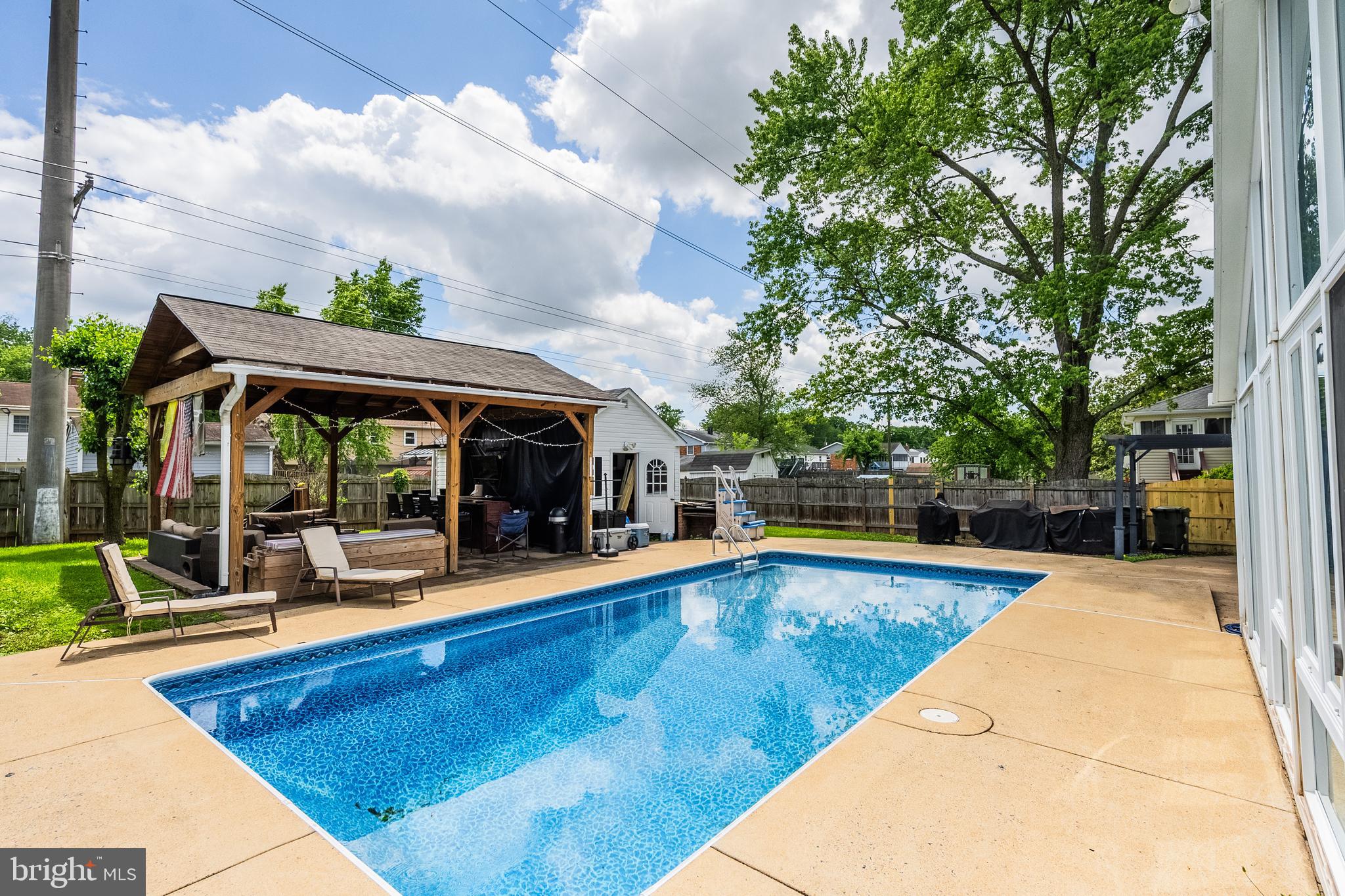 9722 Copeland Drive Manassas, VA 20109 - Photo 10 of 46 a view of swimming pool with lawn chairs and plants