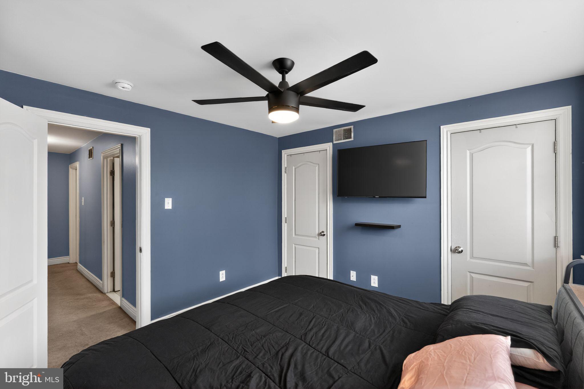 2907 South Sydenham Street Philadelphia, PA 19145 - Photo 11 of 15 a bedroom with a bed and a ceiling fan