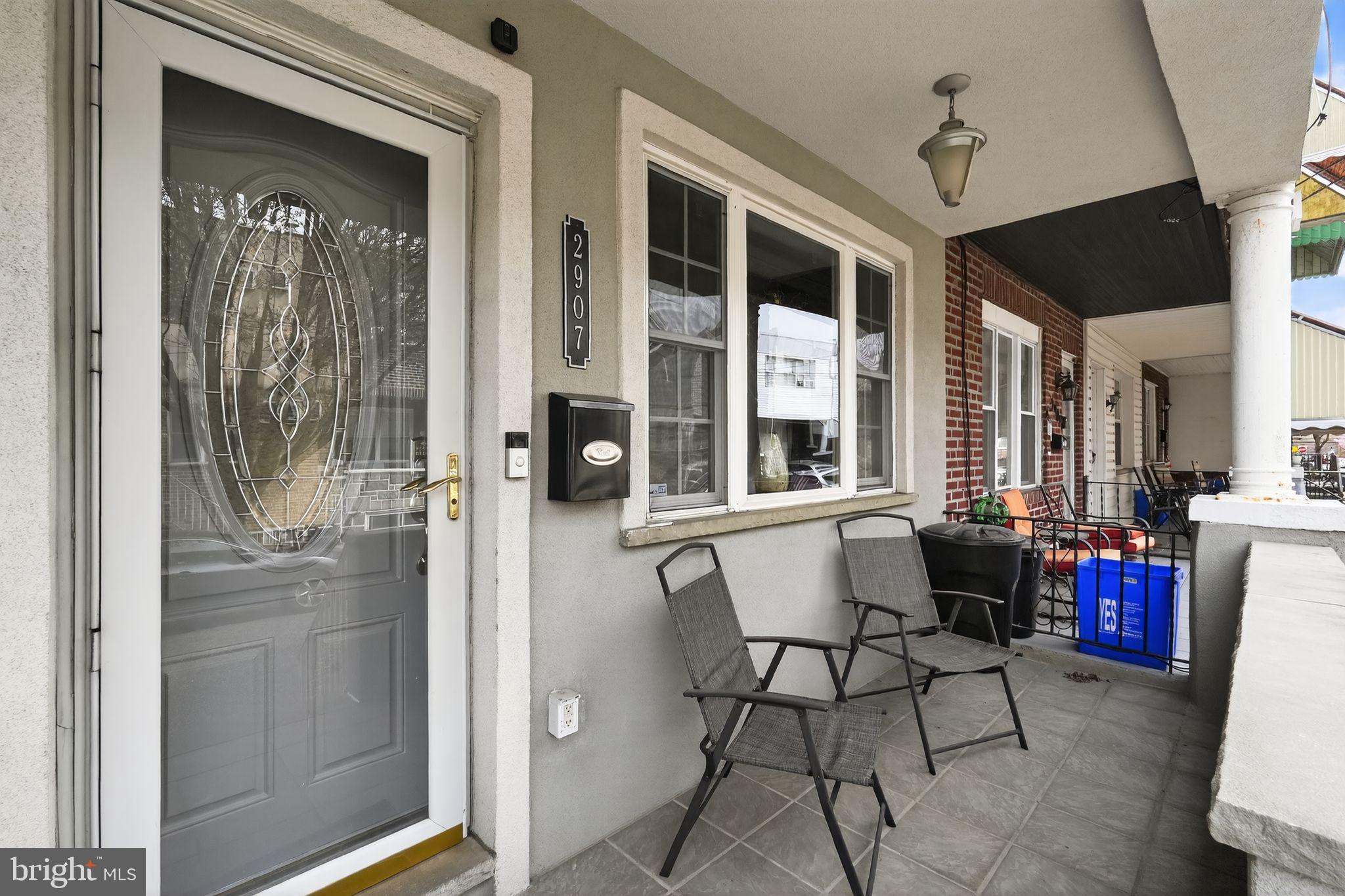 2907 South Sydenham Street Philadelphia, PA 19145 - Photo 15 of 15 a balcony with furniture and a potted plant