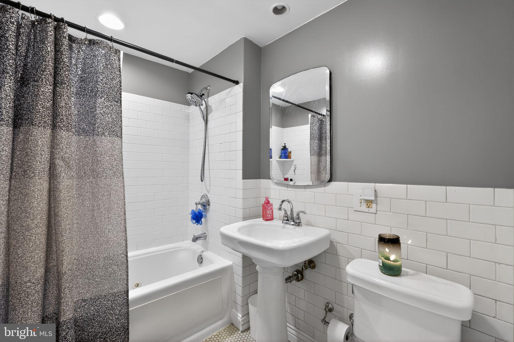 2907 South Sydenham Street Philadelphia, PA 19145 - Photo 6 of 15 a bathroom with a sink toilet and shower