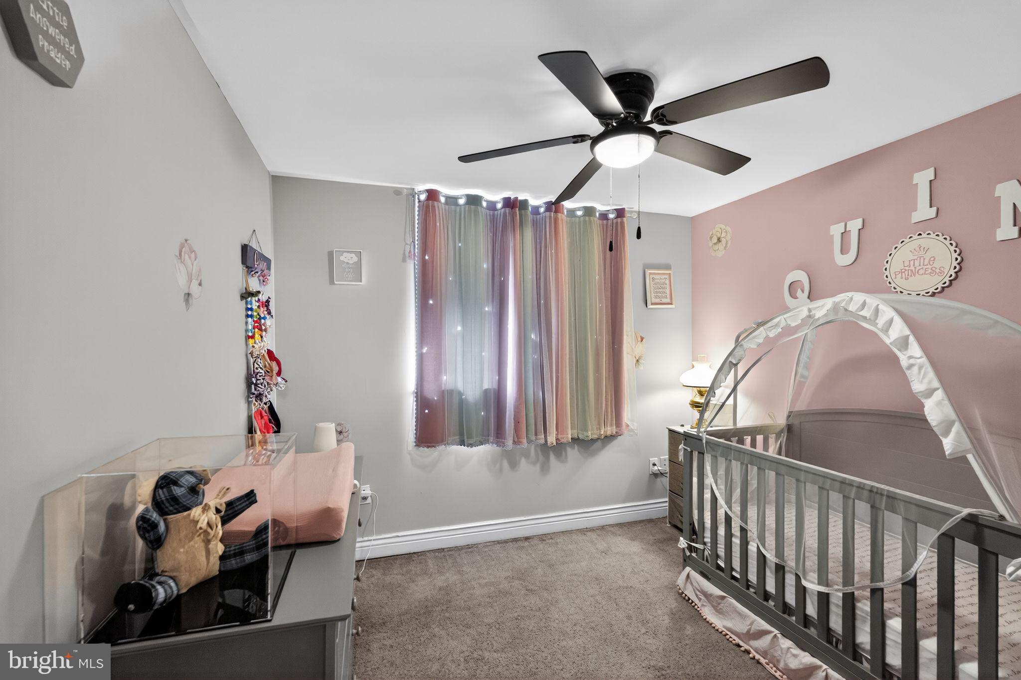 2907 South Sydenham Street Philadelphia, PA 19145 - Photo 7 of 15 a living room with furniture and a ceiling fan
