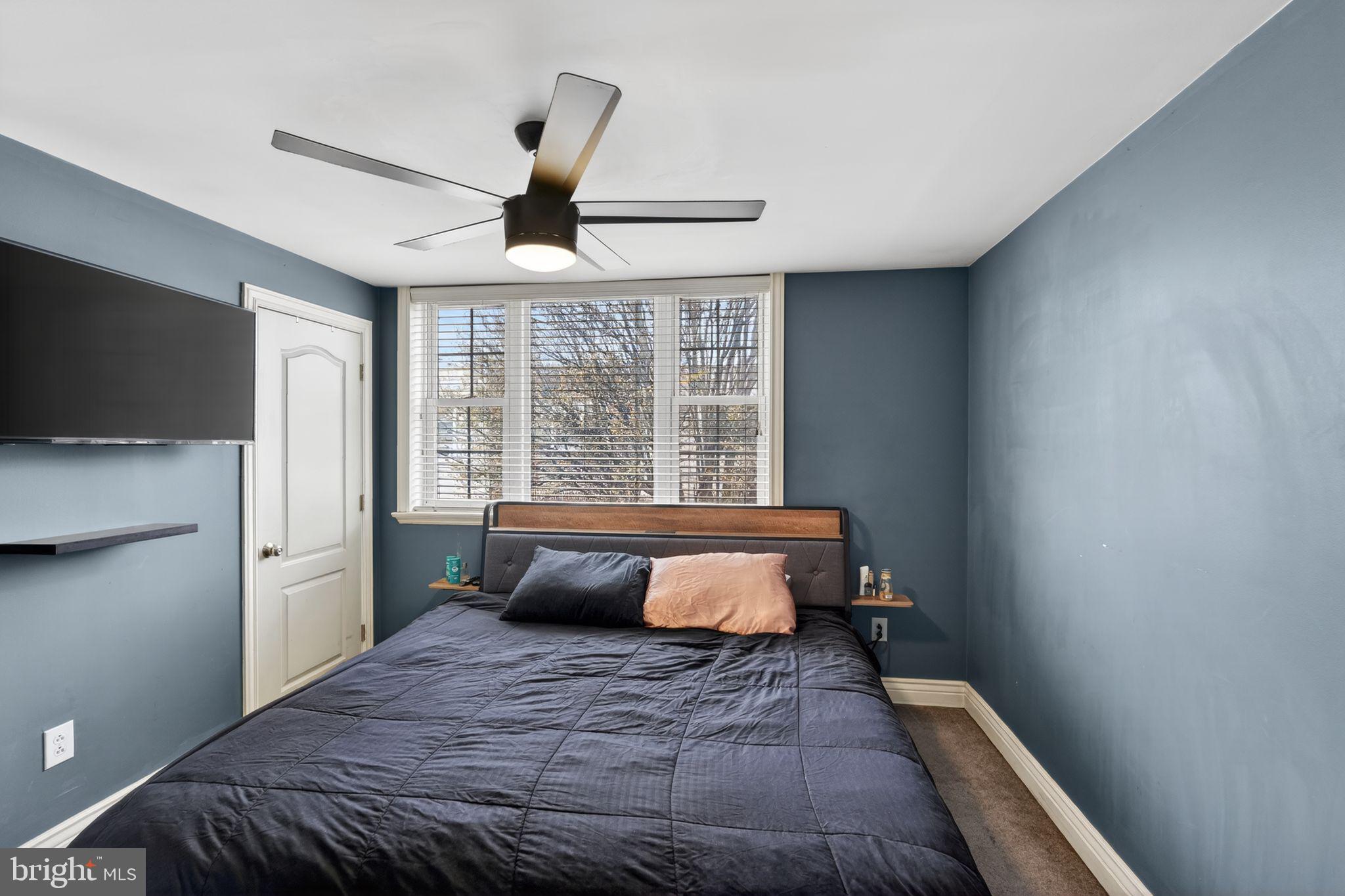 2907 South Sydenham Street Philadelphia, PA 19145 - Photo 10 of 15 a bedroom with a bed and wooden floor