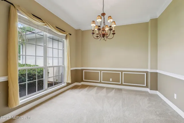 an empty room with a ceiling fan