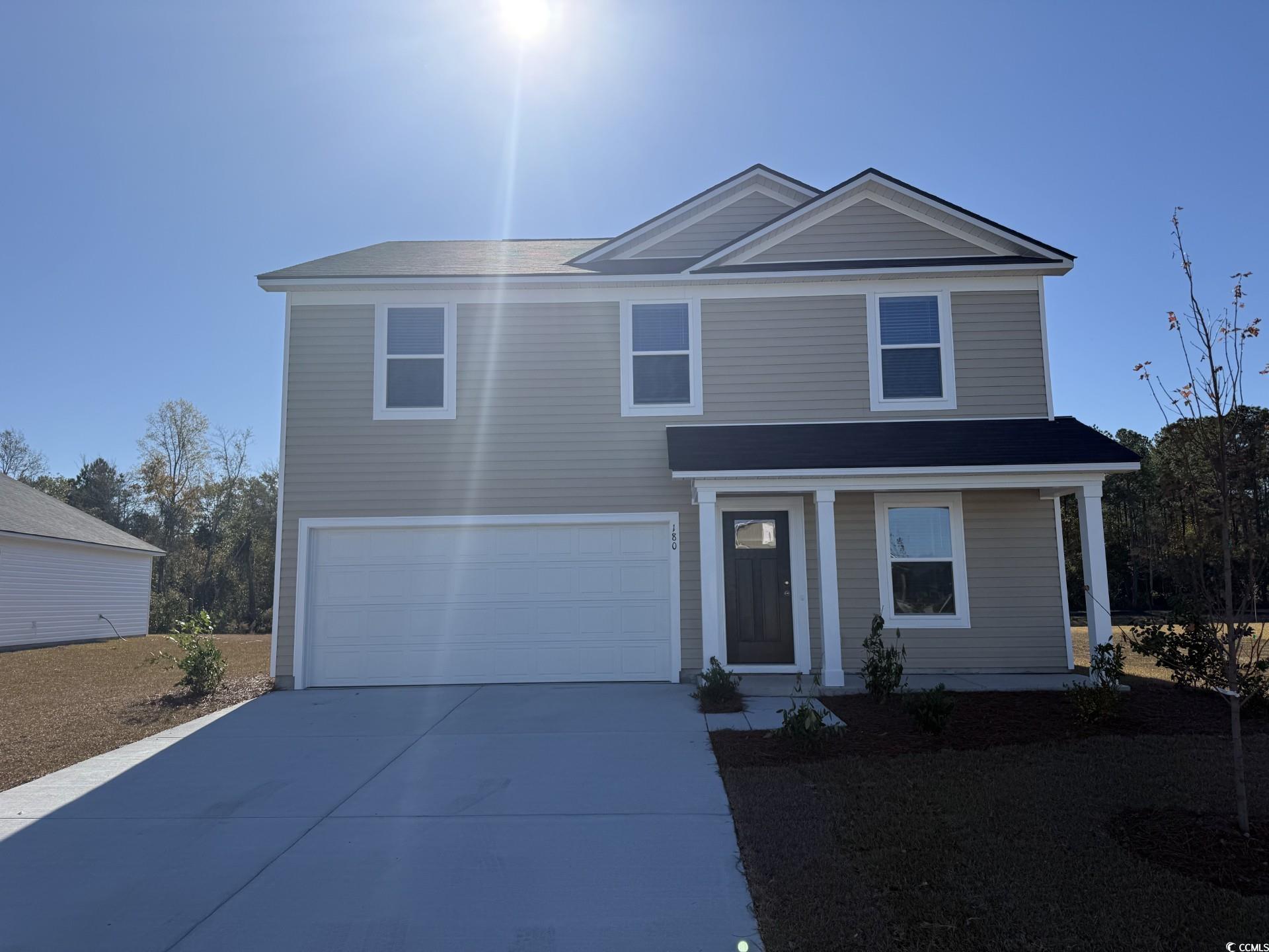 180 Warner Xing Way Loris, SC 29569 - Photo 1 of 21 View of front of property featuring driveway and a garage