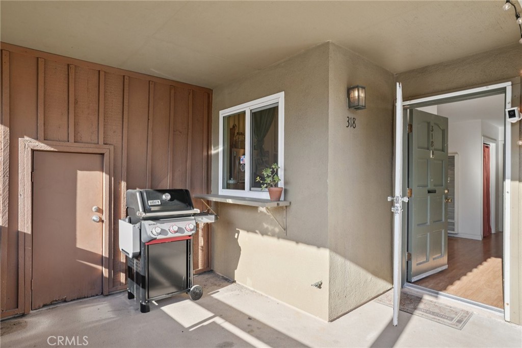 1001 West Stevens Avenue, Unit 318 Santa Ana, CA 92707 - Photo 3 of 19 a view of a hallway with workspace and a window