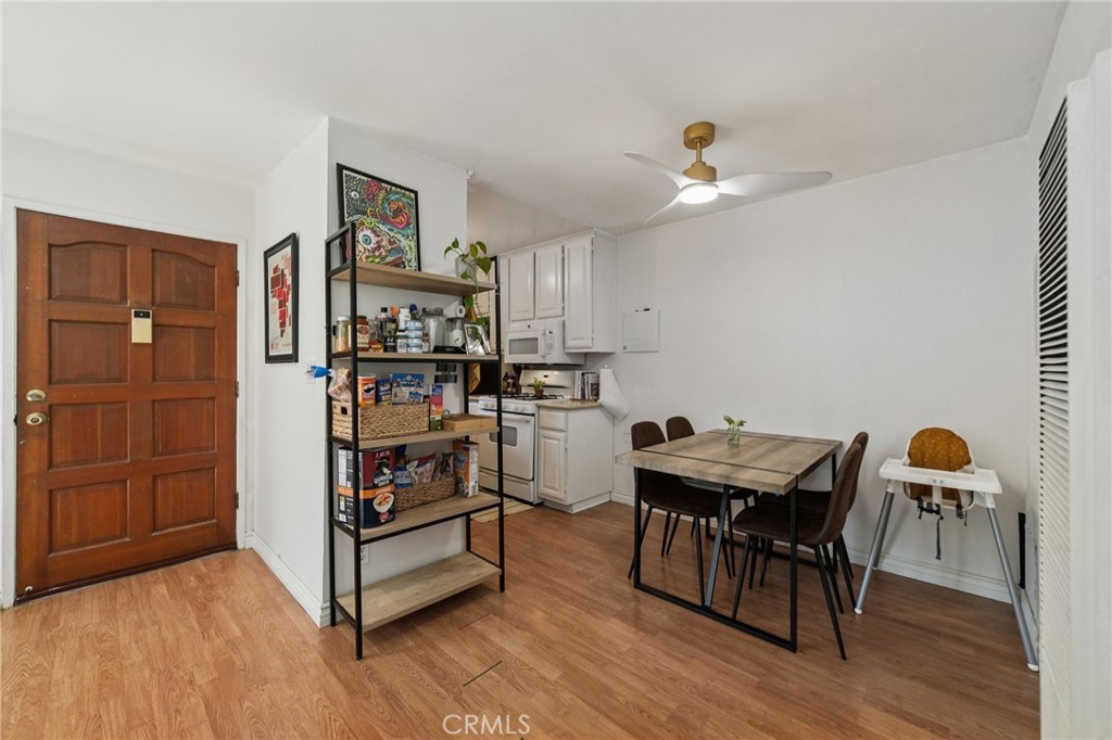 1001 West Stevens Avenue, Unit 318 Santa Ana, CA 92707 - Photo 8 of 19 a view of a workspace with furniture and wooden floor