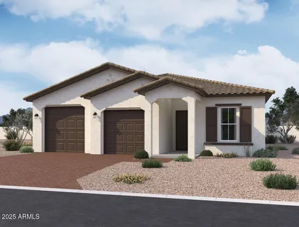 a view of a house with a dry yard and garage