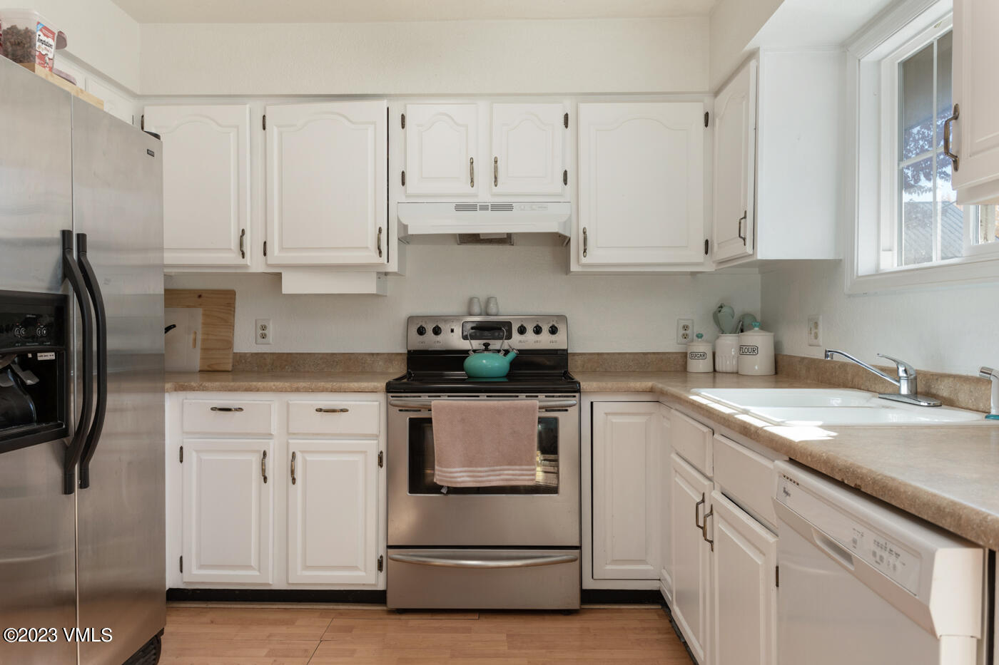 503 Park View Lane Gypsum, CO 81637 - Photo 13 of 24 a kitchen with white cabinets and white appliances