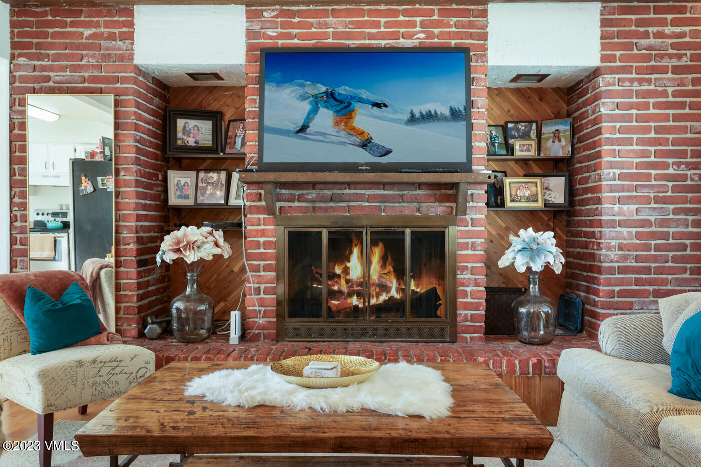 503 Park View Lane Gypsum, CO 81637 - Photo 17 of 24 a living room with furniture a fireplace and wall paintings