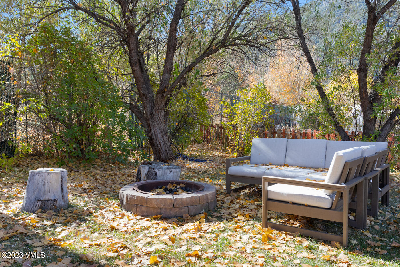 503 Park View Lane Gypsum, CO 81637 - Photo 18 of 24 a view of a backyard with table and chairs potted plants and tree