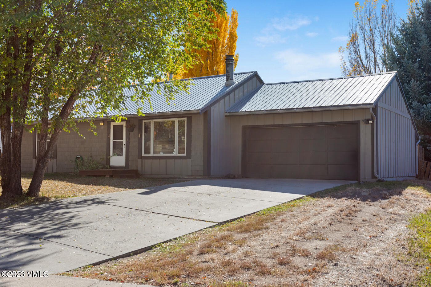503 Park View Lane Gypsum, CO 81637 - Photo 19 of 24 a front view of a house with a yard and garage