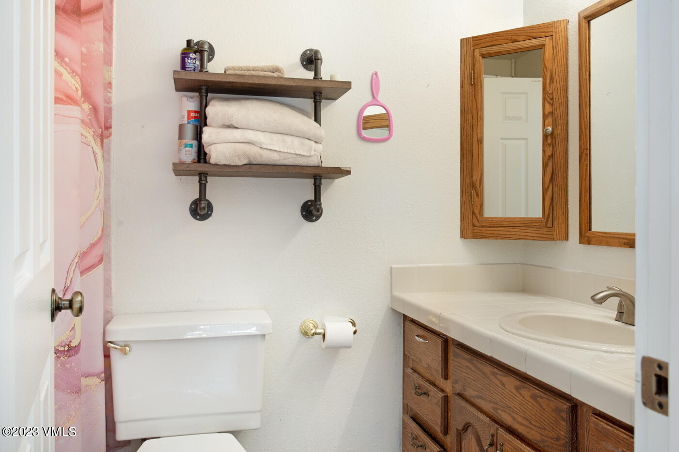 503 Park View Lane Gypsum, CO 81637 - Photo 4 of 24 a bathroom with a sink and a mirror