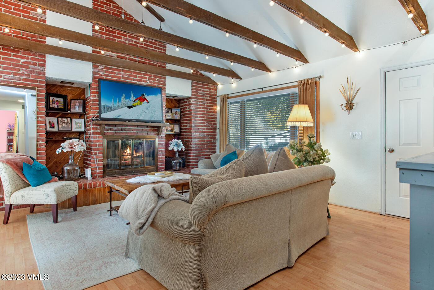 503 Park View Lane Gypsum, CO 81637 - Photo 9 of 24 a living room with furniture a fireplace and a flat screen tv