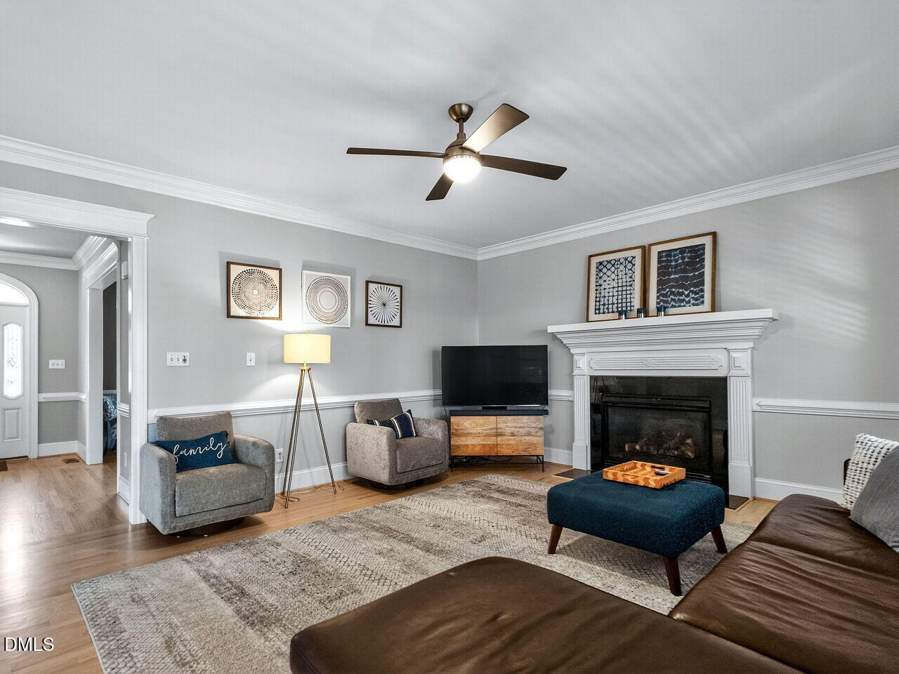 7208 Rippling Stone Lane Raleigh, NC 27612 - Photo 11 of 57 a living room with furniture and a fireplace