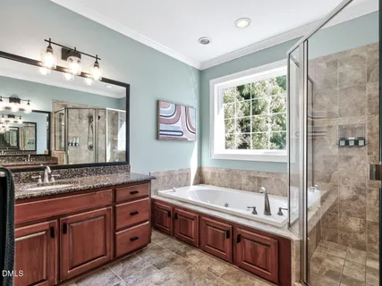 a bathroom with a granite countertop tub sink double vanity granite and shower