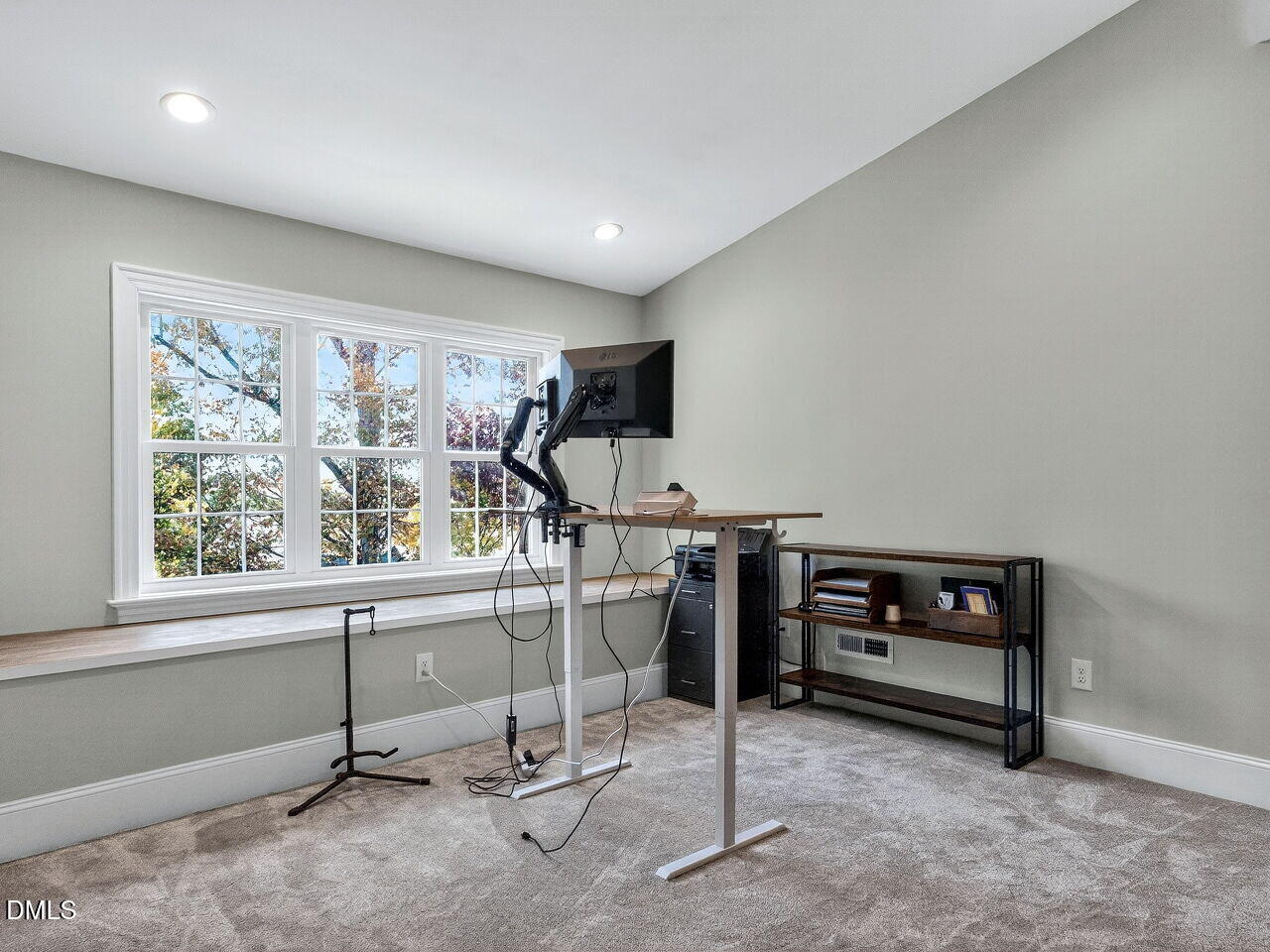 7208 Rippling Stone Lane Raleigh, NC 27612 - Photo 35 of 57 a view of a workspace with furniture and a window