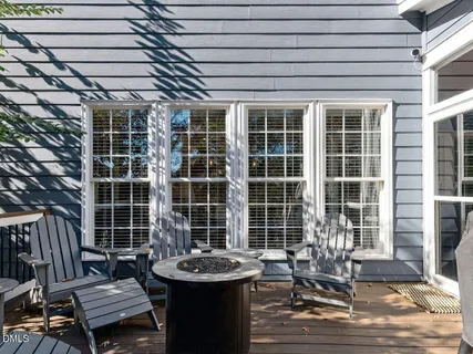 a view of a chairs and table in a patio