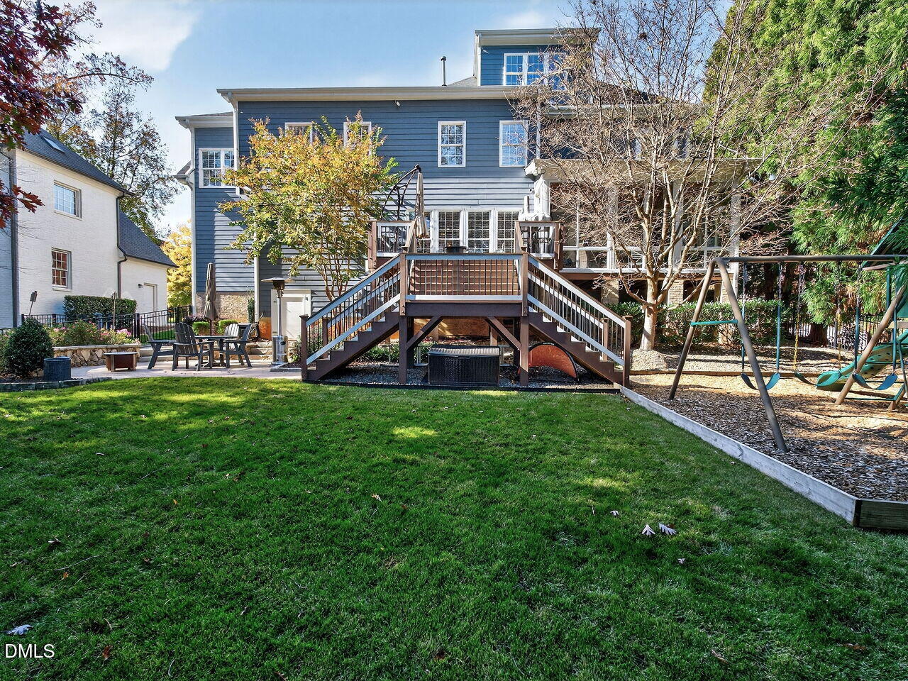 7208 Rippling Stone Lane Raleigh, NC 27612 - Photo 45 of 57 a view of a house with a big yard and large trees