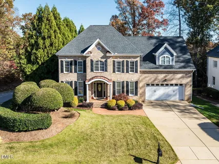 a front view of a house with a yard outdoor seating and entertaining space