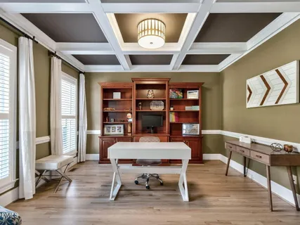 a view of a room with furniture and window