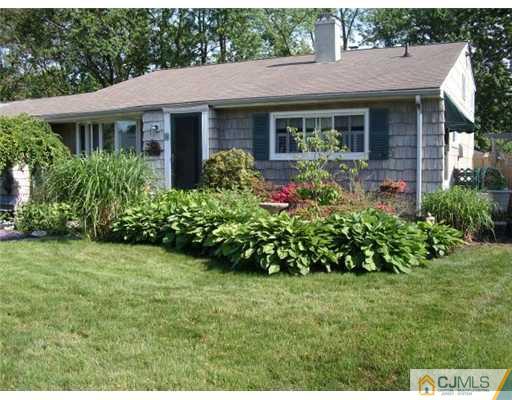 51 Westminster Road Colonia, NJ 07067 - Photo 1 of 25 a view of a house with garden and yard