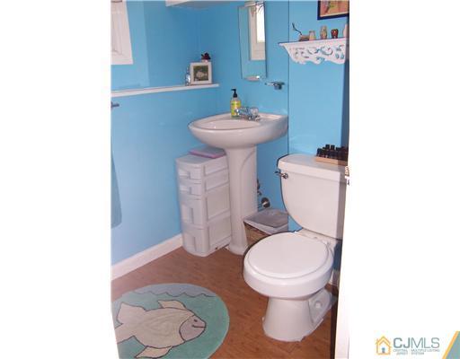 51 Westminster Road Colonia, NJ 07067 - Photo 21 of 25 a bathroom with a toilet and a sink