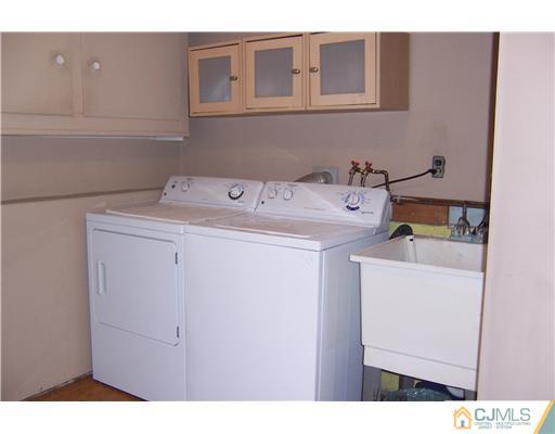 51 Westminster Road Colonia, NJ 07067 - Photo 23 of 25 a utility room with dryer and washer