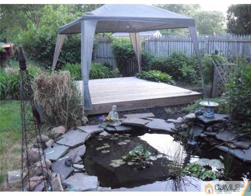 51 Westminster Road Colonia, NJ 07067 - Photo 25 of 25 a view of a backyard with plants and a patio