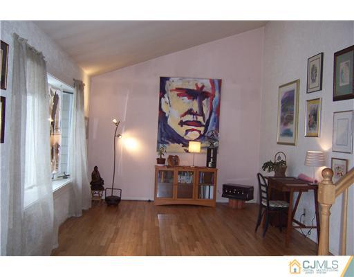 51 Westminster Road Colonia, NJ 07067 - Photo 4 of 25 a room with furniture and wooden floor