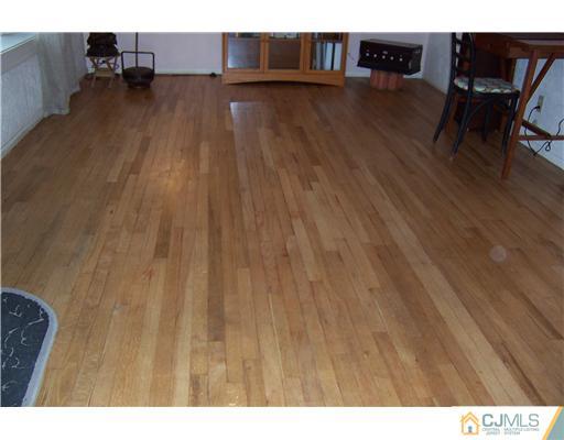 51 Westminster Road Colonia, NJ 07067 - Photo 8 of 25 a view of a livingroom with furniture and wooden floor
