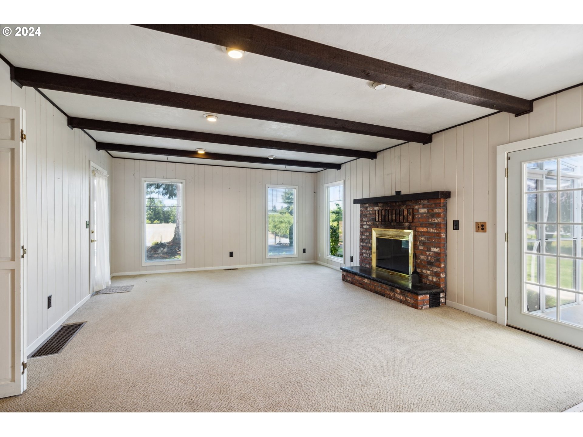 27274 South Meridian Road Aurora, OR 97002 - Photo 8 of 33 a view of an empty room with fire place and a window
