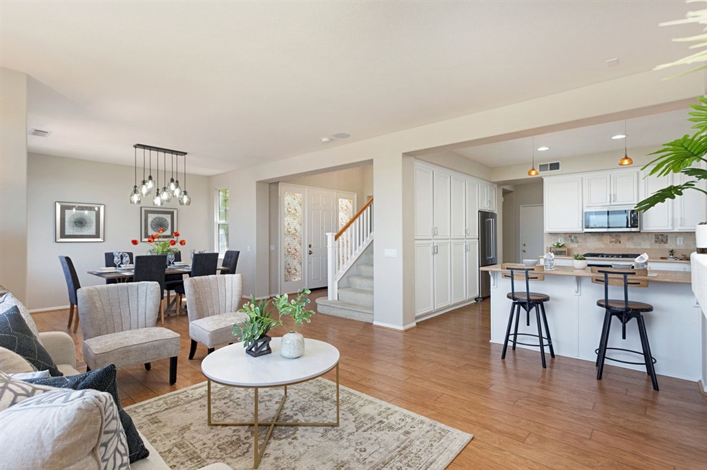 3530 Harwich Drive Carlsbad, CA 92010 - Photo 7 of 25 a living room with furniture and a wooden floor