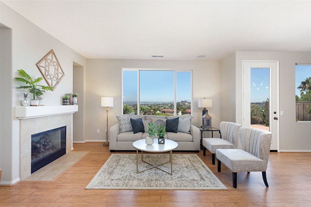 3530 Harwich Drive Carlsbad, CA 92010 - Photo 8 of 25 a living room with furniture and a fireplace