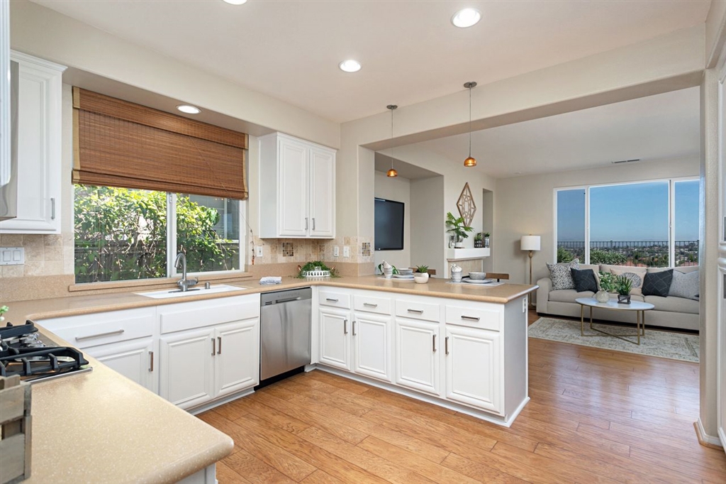 3530 Harwich Drive Carlsbad, CA 92010 - Photo 9 of 25 a large white kitchen with a large window