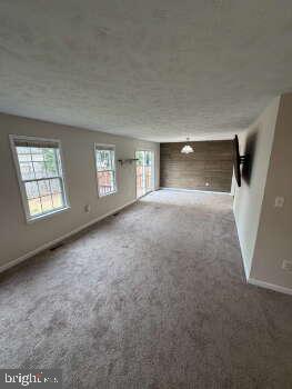 313 3rd Street Colonial Beach, VA 22443 - Photo 29 of 36 Spacious living area with natural light.