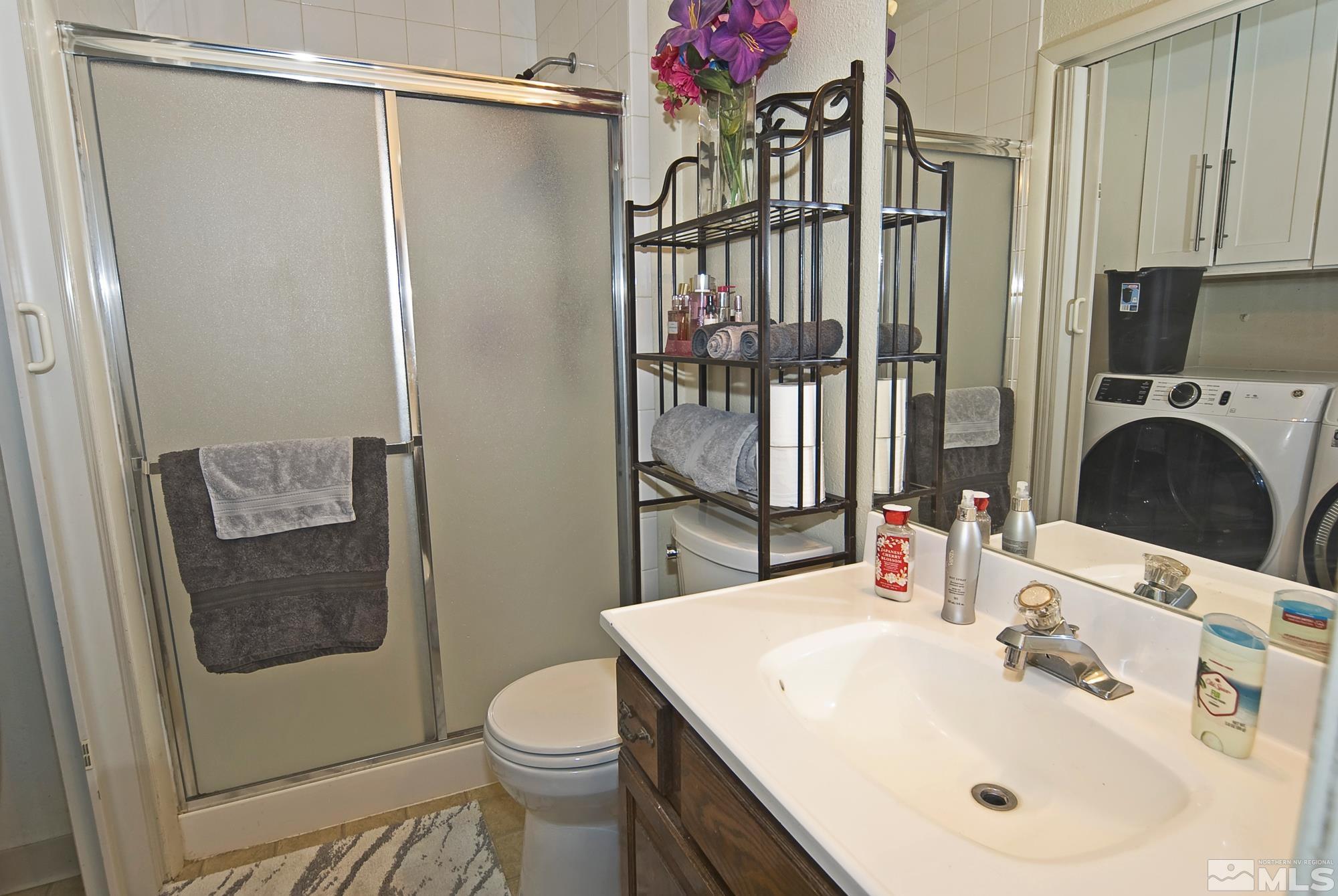 3030 Accacia Way Reno, NV 89503 - Photo 18 of 32 a bathroom with a sink toilet and shower