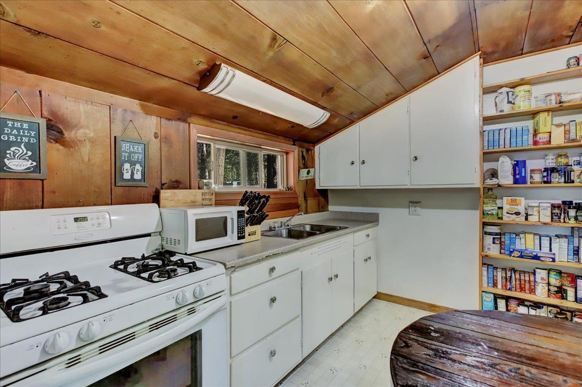 778-758 Sawmill Road Alta, CA 95701 - Photo 33 of 46 a kitchen with stainless steel appliances a stove a sink and a refrigerator