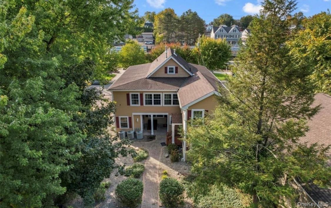 10 Burnside Avenue, Unit F Congers, NY 10920 - Photo 2 of 12 a house with trees in the background
