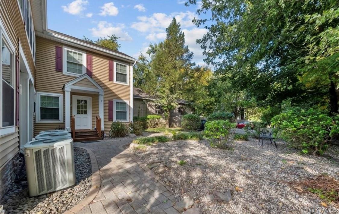 10 Burnside Avenue, Unit F Congers, NY 10920 - Photo 4 of 12 a front view of a house with garden