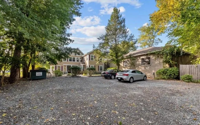 a view of a car is parked in front of a house