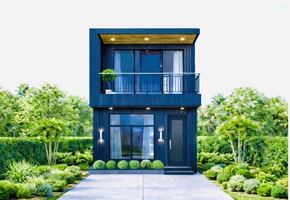 a front view of a house with plants and entryway