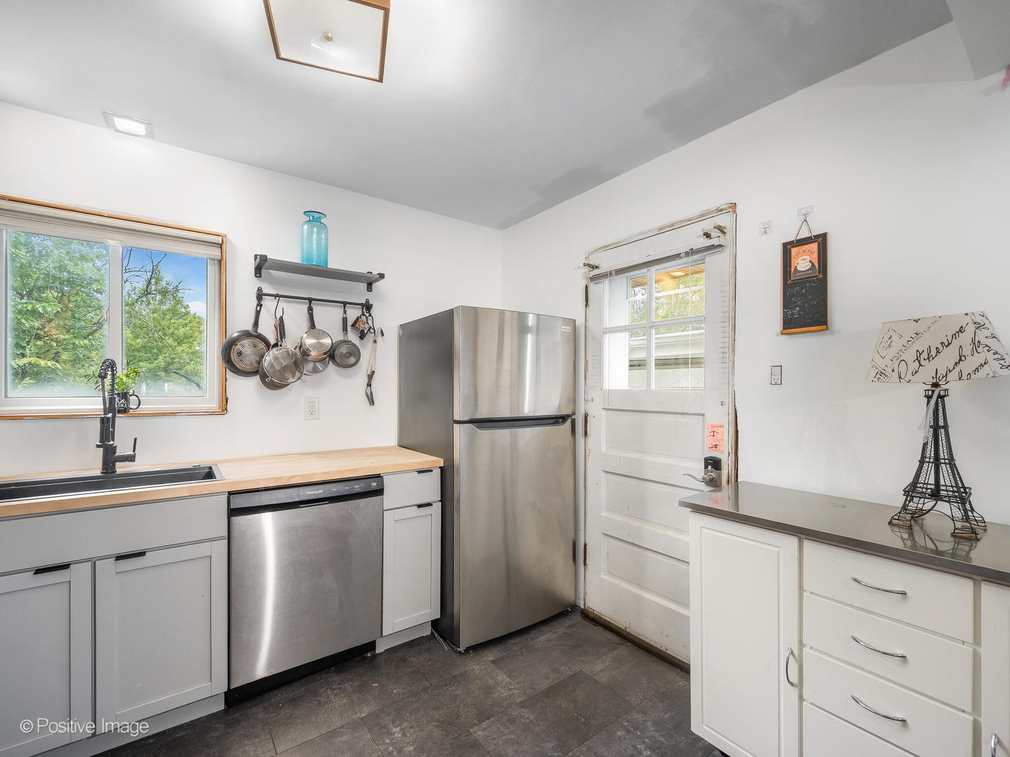 18646 Palmer Circle Homewood, IL 60430 - Photo 4 of 17 a kitchen with white cabinets and white appliances