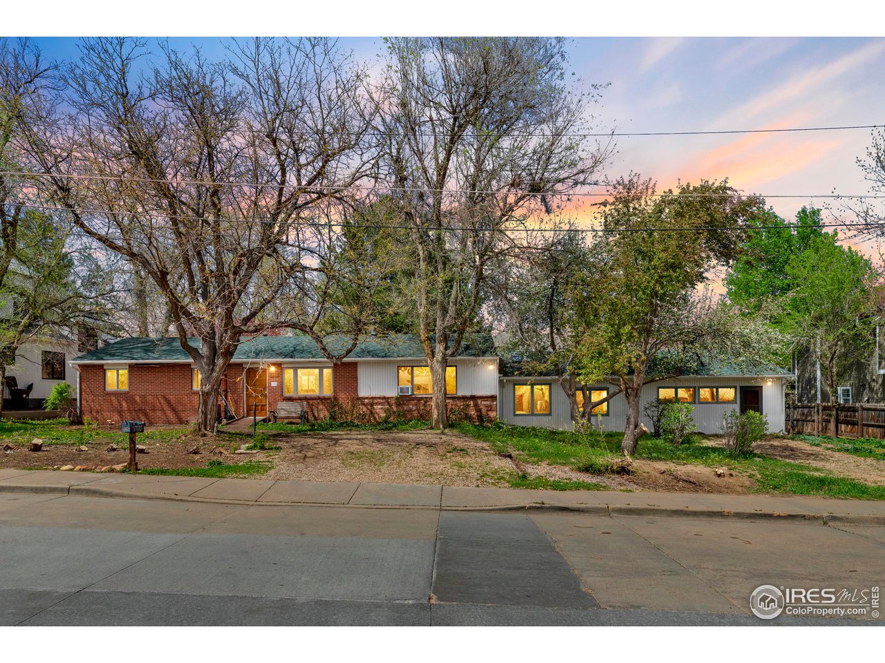 855 Union Avenue Boulder, CO 80304 - Photo 1 of 21 a backyard of a house with large trees and outdoor seating