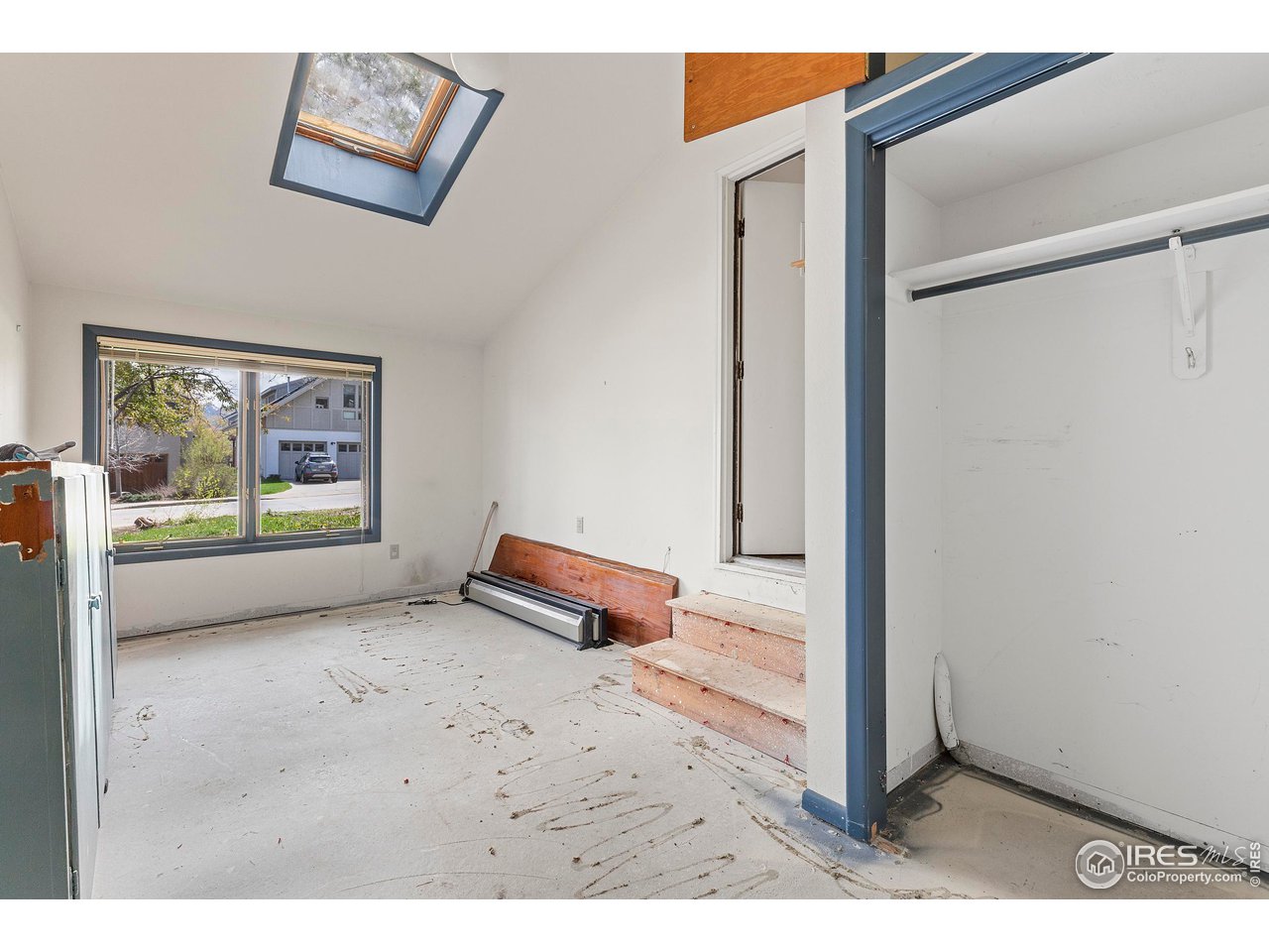 855 Union Avenue Boulder, CO 80304 - Photo 15 of 21 a view of an empty room with wooden floor and window
