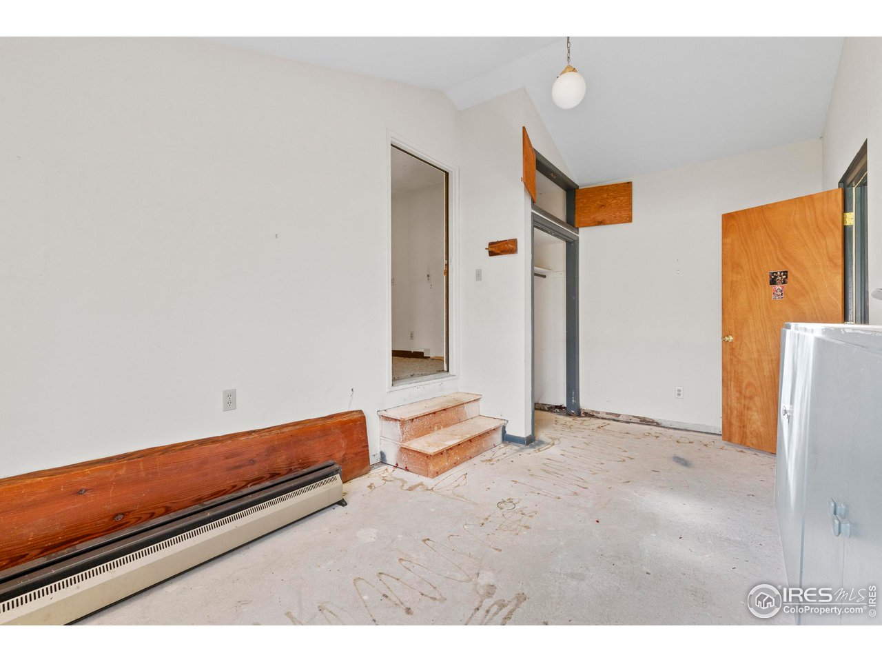 855 Union Avenue Boulder, CO 80304 - Photo 17 of 21 a view of an empty room with wooden floor