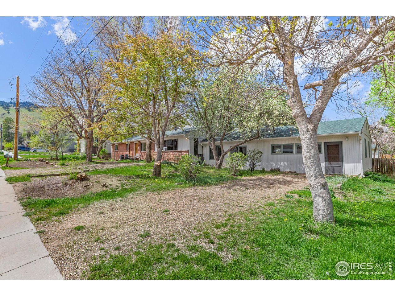 855 Union Avenue Boulder, CO 80304 - Photo 4 of 21 a front view of a house with a yard and trees