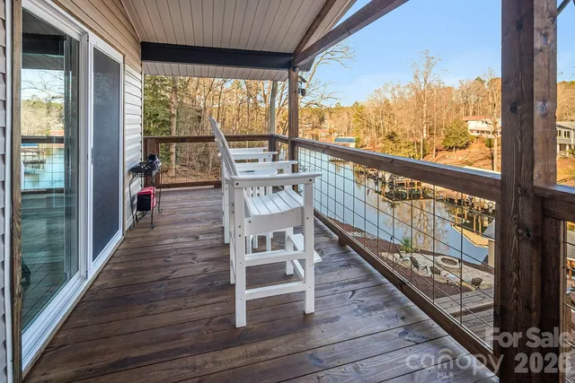 a view of a balcony with wooden floor