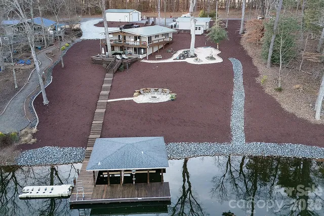 a view of a patio with table and chairs and potted plants
